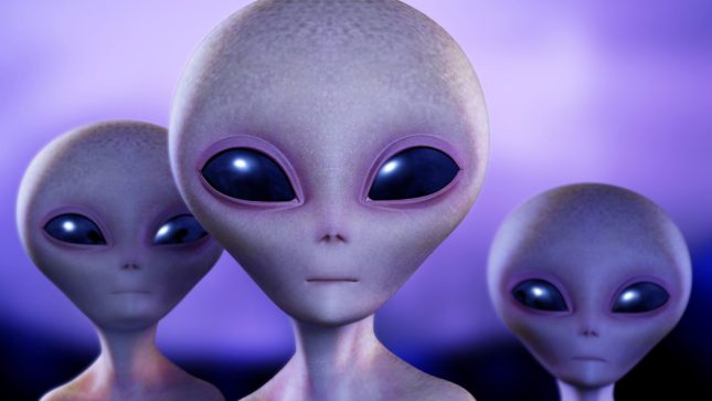 Three purple aliens who look very serious in a light and dark purple and black, cloudy background.