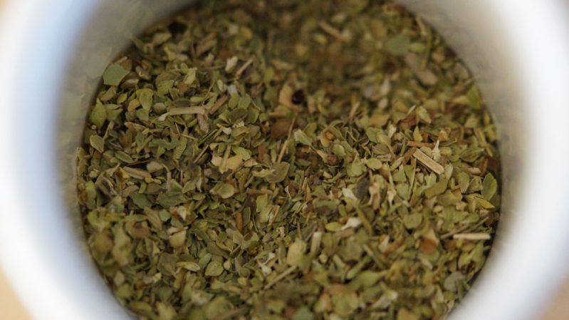 Oregano in a white bowl.