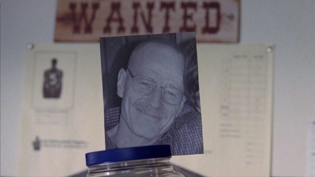 Walter White donation jar under a "WANTED" sign on the board.