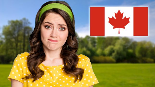 Brunette white girl green eyes green headband yellow shirt against generic grass and trees and sky background with canadian flag beside her