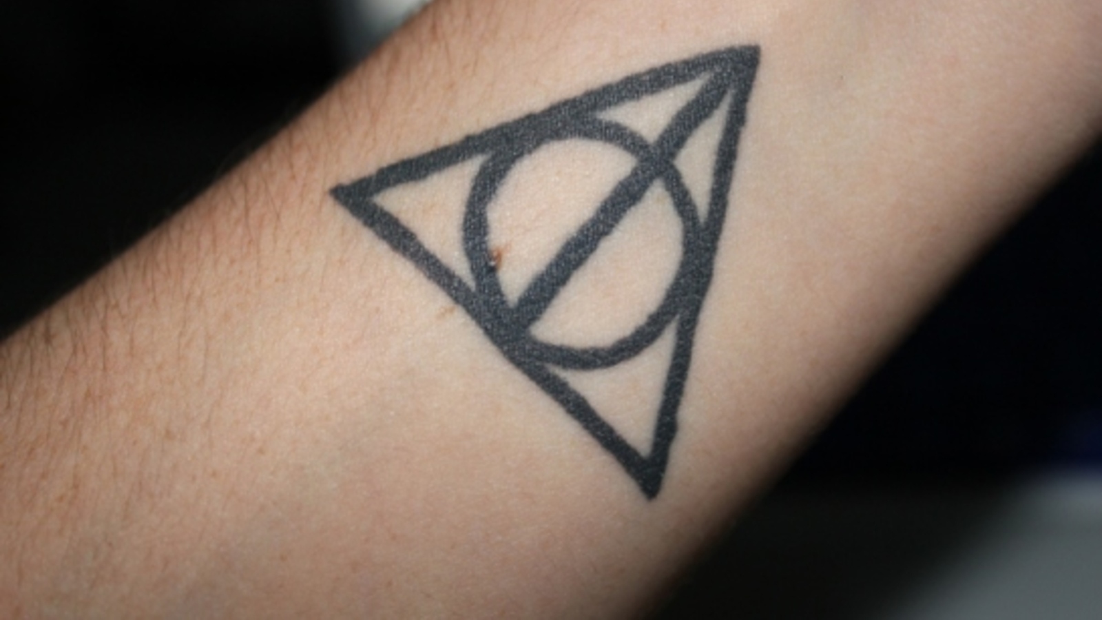 1. "Deathly Hallows symbol tattoo" - wide 9