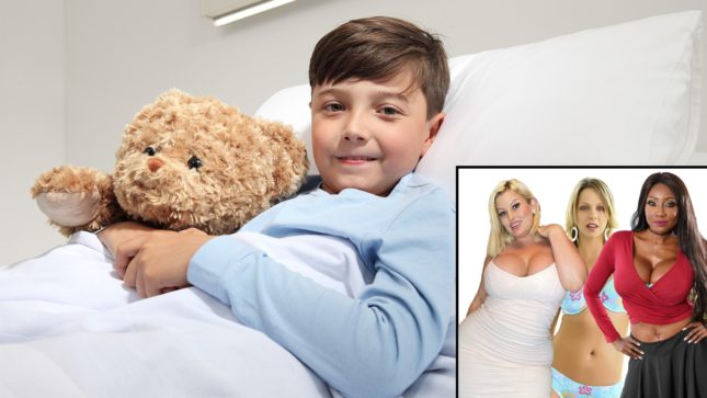 A young teenager in a blue shirt in a hospital bed clutching a tan teddy bear, covered by a white blanket, sitting against a white pillow and whit ewall. The boy has tan skin and light brown hair and brown eyes. In a box to the right are three women: one busty white woman with blonde hair and blue eyes and a white dress, another blonde white woman with blue eyes, and a black woman who is busty and has green eyes and long light brown hair holding her hands on her hips, wearing a v-neck red shirt and a black skirt, her belly button exposed.