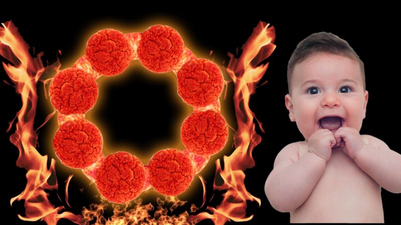 A pale baby with flushed red skin, black hair and small brown eyes who looks excited with its fingers in its mouth. There is a black background and a red teething ring surrounded by flames besides the baby.